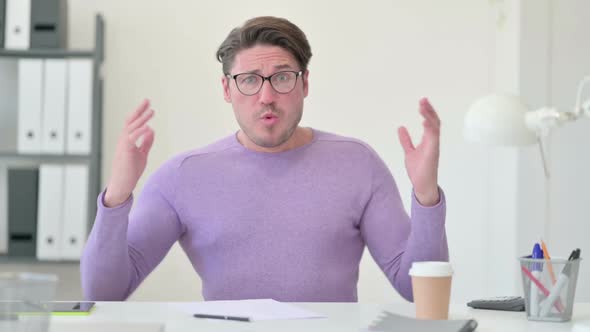 Middle Aged Man Reacting to Failure alt