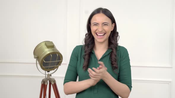 Indian woman cheering alt