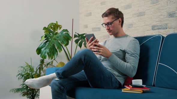 Lifestyle Concept  Young Man Working with Tablet Pc Computer alt