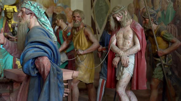 Terracotta sculptures of Jesus Christ on the road to calvary on a biblical character scene represent alt