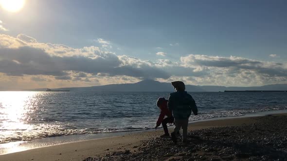 Kids Play At Dusk, Kalamata Beach , End Of Spring alt