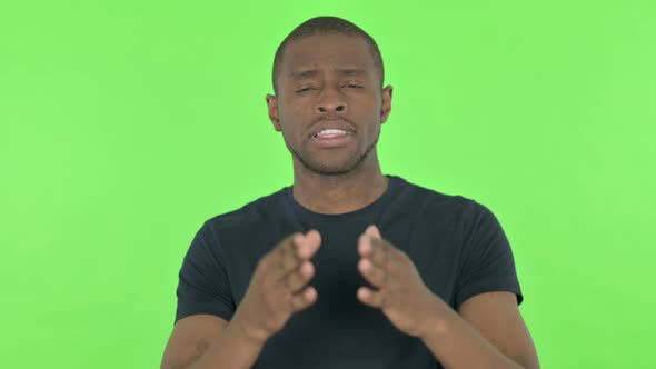Video Chat By Young African Man on Green Background alt