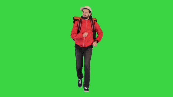 Delivery Man Running with Thermo Backpack on a Green Screen Chroma Key