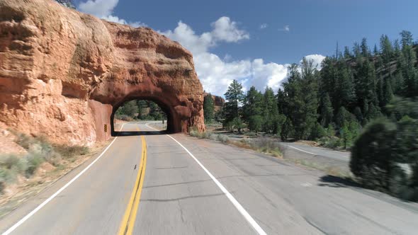 Epic Drone Flight Through the Natural Arch in the Red Rock at Bryce Canyon.  alt