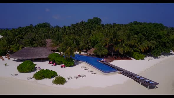Aerial drone shot landscape of idyllic lagoon beach time by aqua blue lagoon with white sandy backgr alt