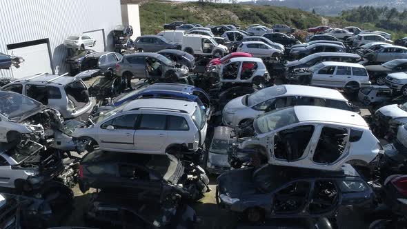 Piles of Old Broken Rusty Cars on Wrecking Yard alt