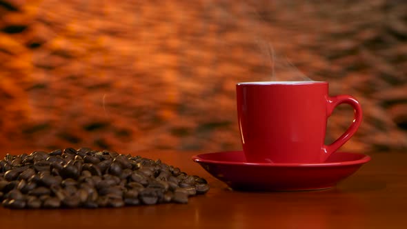 Cup on a Red Saucer of Hot Coffee on the Aroma Spreads Room alt
