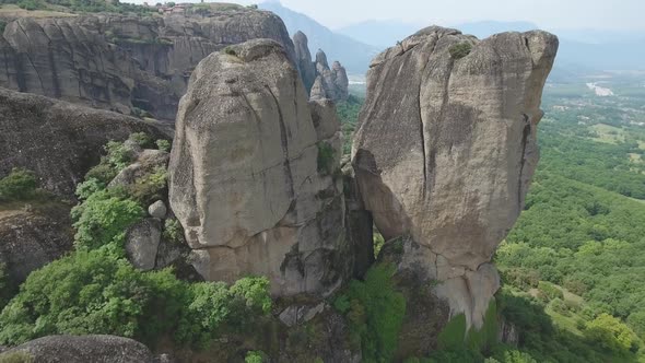 Flying over Meteora rock formations and monasteries in Greece alt