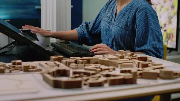 Close Up of Architectural Desk with Building Model alt