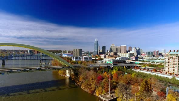 Rising drone footage of downtown Cincinnati Ohio with busy traffic on the highway alt