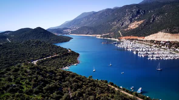 The top view from the drone of Kas resorts, bay with yahts and city in Mugla province of Turkey
