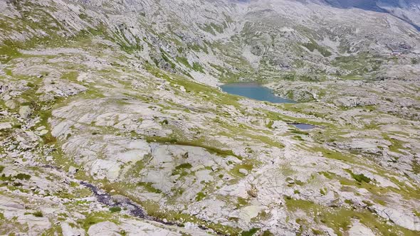Flying over the Glacier of Adamello Mountains alt
