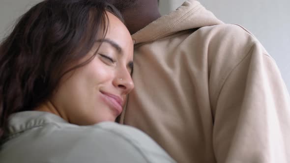 Close Up Of Loving Young Couple At Home Hugging In Kitchen Together alt