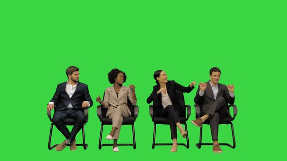 Young Office Workers Having Fun on a Break Shaking to Some Music on a Green Screen Chroma Key alt