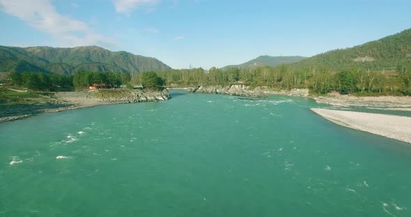 Low Altitude Flight Over Fresh Fast Mountain River with Rocks at Sunny Summer Morning alt