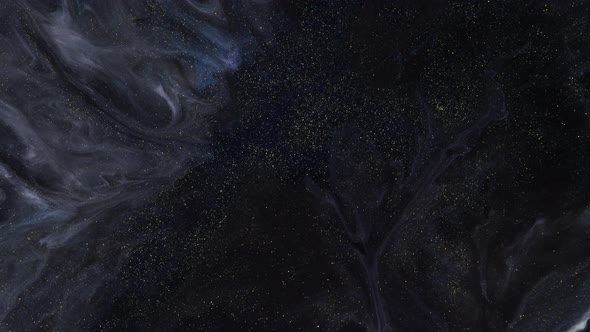 Beautiful Gold Shimmering Particles with Lens Flare on Black Background in Slow Motion alt