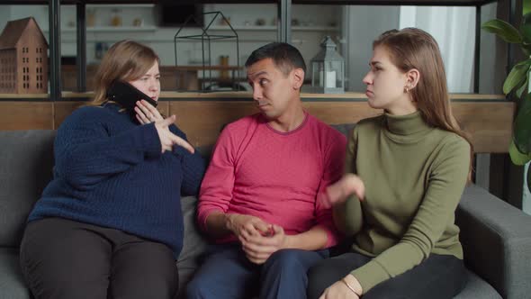 Woman Helping Deaf Couple to Communicate with Friends alt