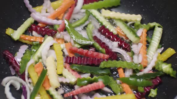 Chef placing vegetables into a hot pan stock video. vegetables cooking alt