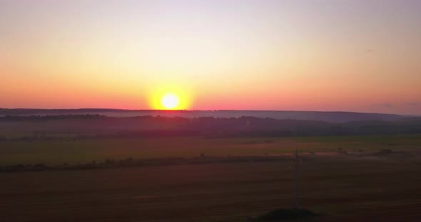 Drone Shot Above Fields of Wheat Rural Midwestern Farm at Sunrise Morning
