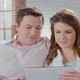 Couple chatting View photos on Tablet - VideoHive Item for Sale