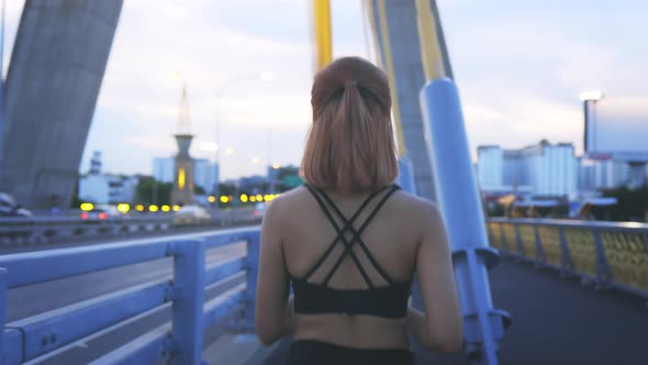 Young Athlete Running on Bridge alt