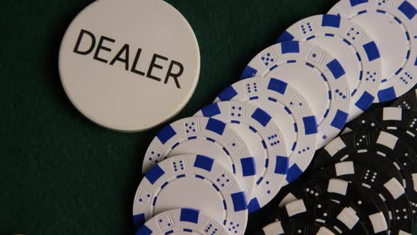 Rotating shot of poker cards and poker chips on a green felt surface - POKER 058 alt