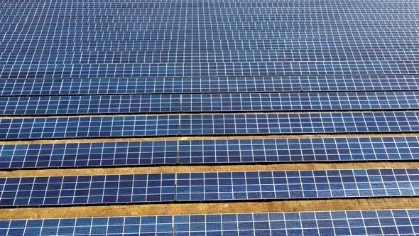 Aerial Drone View Flight Over Solar Power Station Panels alt