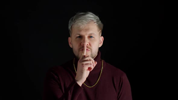 Strict Serious Man Asking to Stay Calm Keep Silence or Secrecy with Finger on Lips Shh Gesture alt