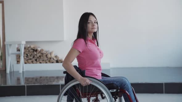 Young Woman in Wheelchair Spending Weekend Time at Home