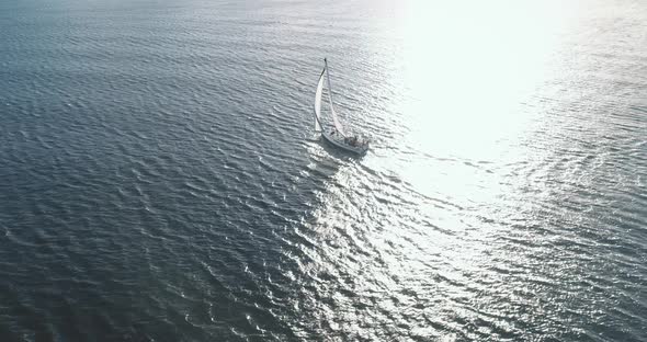 Slow Motion of Sailing Yacht at Sun Reflect Ocean Gulf