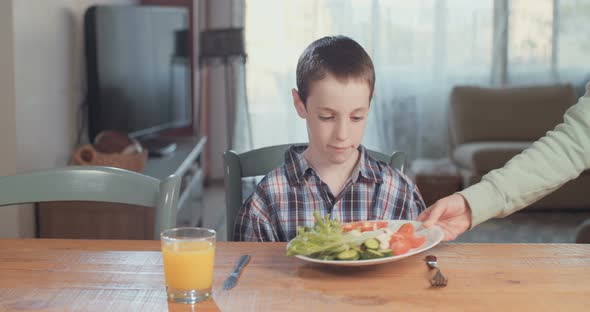 Child nutrition - boy refusing to eat healthy food alt