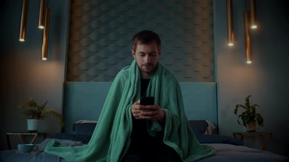 Sick Man Having a Flu Cold Use Smartphone