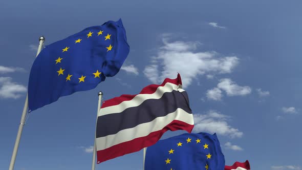 Flags of Thailand and the European Union Against Blue Sky alt