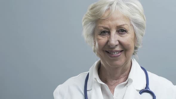 Smiling senior female doctor with stethoscope