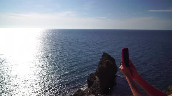 Young Beautiful Caucasian Woman in a Red Suit Going on the Beach for Practicing Yoga Fitness and alt