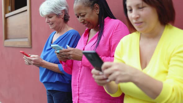 Senior People Having Fun Using Mobile Phones Outdoor  Elderly Technology Addiction Concept alt
