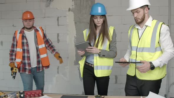 Young Architects and Technician Discussing