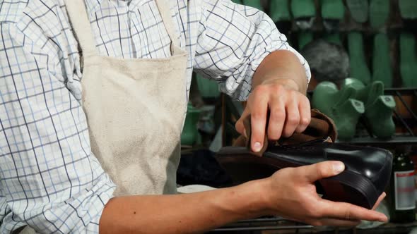 Shoemaker Polishing Leather Shoes with a Piece of Soft Cloth 1080p alt