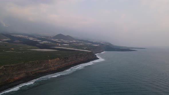 Aerial drone view of solidified lava on banana plantation fields, La Palma island alt