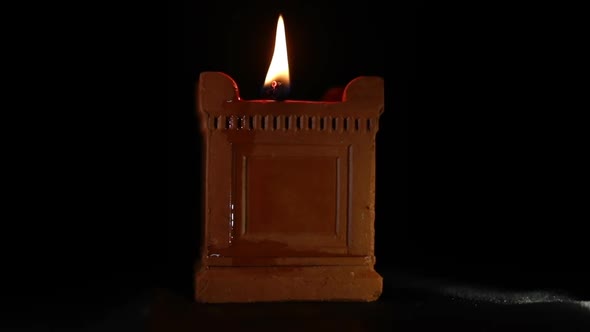 Handmade Diya (oil lamp) at dark background