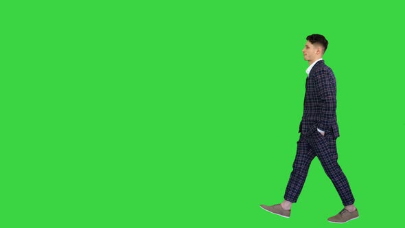 Young Cool Elegant Man Walking By on a Green Screen, Chroma Key alt
