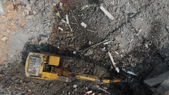 Aerial Overhead Moving Forward View of a Demolition Site with Two Excavators