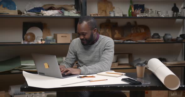 Image of African American Businessman Working on His Laptop alt