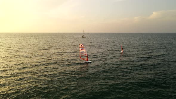 Aerial View of Windsurfing Surfing in the Calm Deep Blue of Sea Extreme Summer Sport Activity