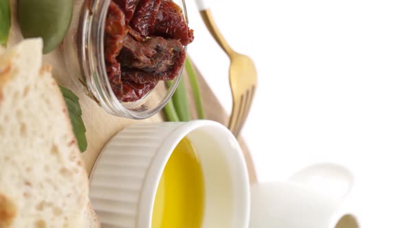 Vertical video: Olive oil with ingredients alt