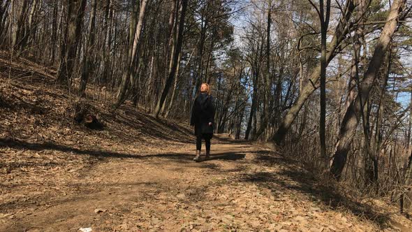 Relaxing in the forest on sunny day slow-mo  1920X1080 HD footage - Walk of  lonely female in nature alt