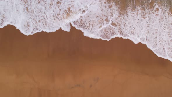 Aerial view Drone camera top down of sea waves in ocean. Turquoise sea surface Amazing sea waves alt