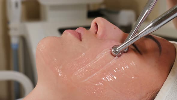 Hardware Procedure in Cosmetology. Close-up. Non-surgical Face Skin Lifting in Beauty Clinic alt