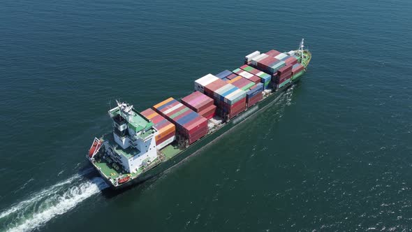 Aerial View of Cargo Container Ship in the Sea alt