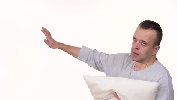 Man Sleepy with Pillow Yawning alt